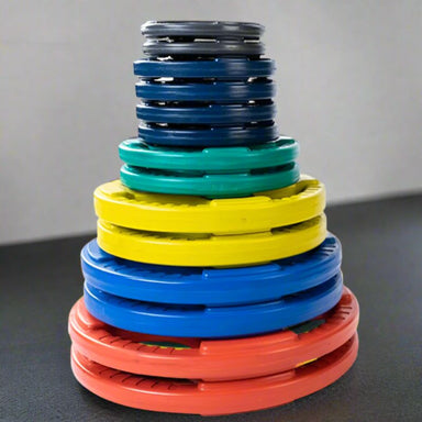 Body-Solid Color Rubber Grip Olympic Sets 255 lb weight plate olympic set inside Gym