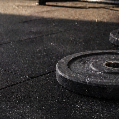 What Is a Rubber Weight Plate? Quiet Strength for Modern Training - Dumbbells Direct Guide