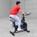 A man using Body Solid Best Fitness BFSB5B Indoor Training Cycle back view