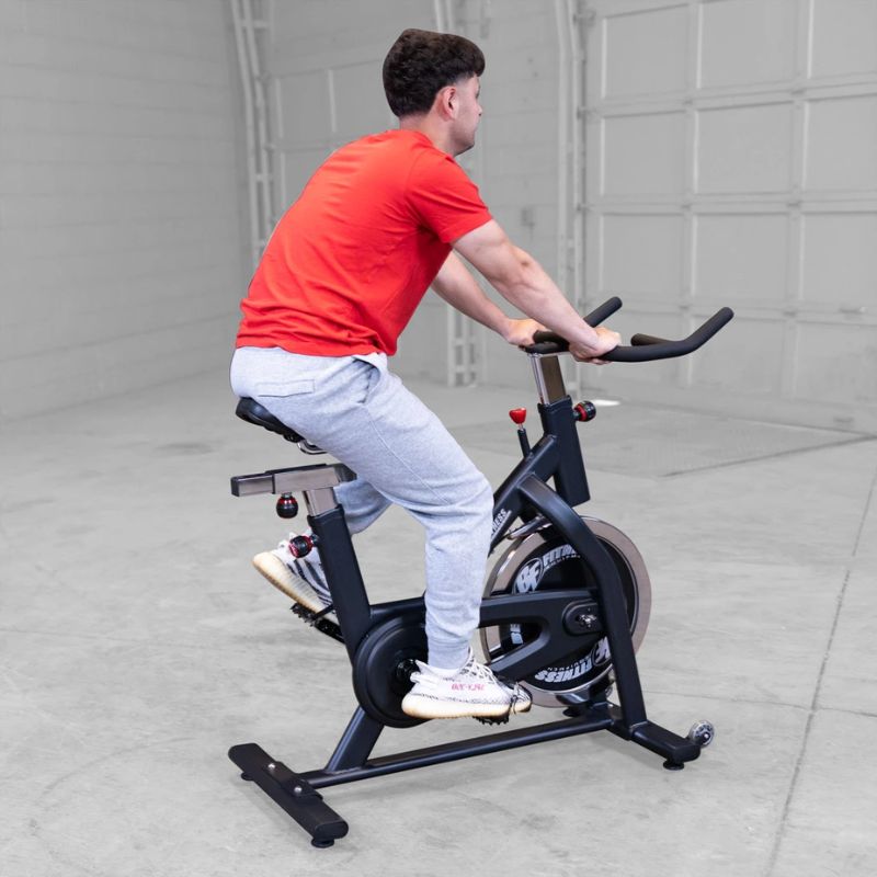 A man using Body Solid Best Fitness BFSB5B Indoor Training Cycle back view