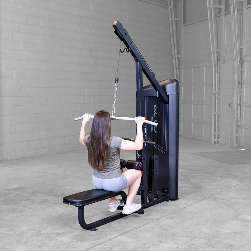 Back view of female doing lat pull down using Body-Solid Pro ClubLine S2LATX Series 2 Lat and Mid-Row
