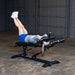 Body-Solid Pro Clubline Commercial Ab Bench SAB500B used in leg raise