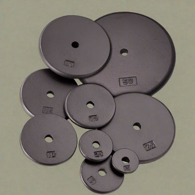 Body-Solid Cast Iron Standard Weight Plates Set inside Gym 