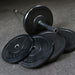 Body-Solid Chicago Extreme Bumper Plates - Black Plates Stacked with Bar