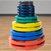 Body-Solid Color Rubber Grip Olympic Plates Stacked Set inside gym 
