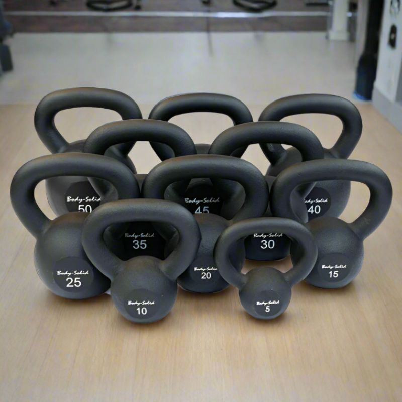 Body-Solid Iron Powder Coat Kettlebells 5-100 Pounds Set 5 lbs to 100 lbs inside Gym