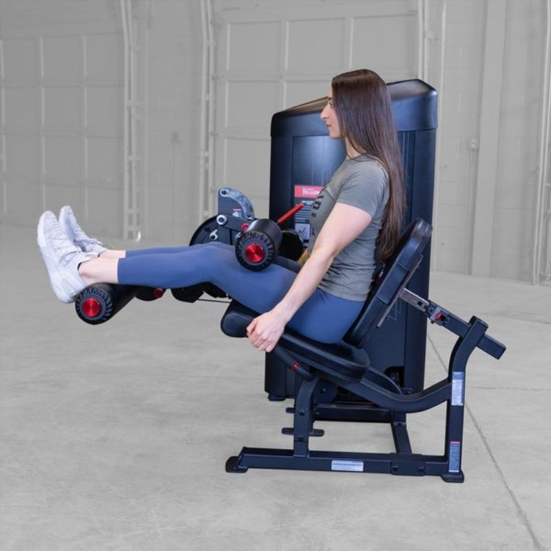 Body-Solid Series II Leg Extension & Leg Curl - S2LEC Leg Curl Exercise Side View Female