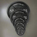 Body Solid Cast Iron Olympic Plates 45 lb, 35 lb, 25 lb, 10 lb, 5 lb, 2.5 lb inside Gym Floor
