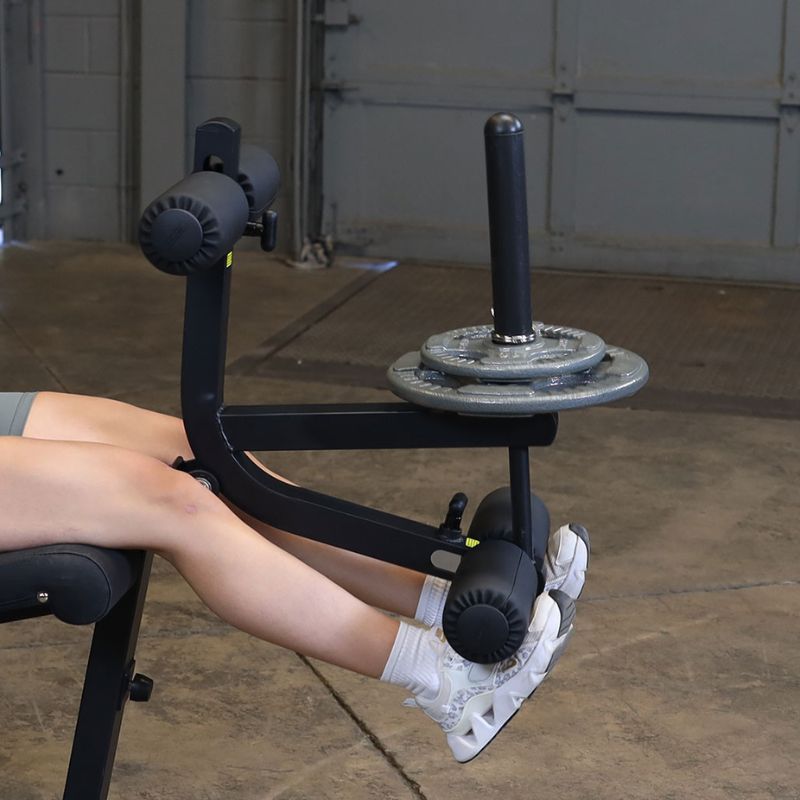 Close up details of the foot pads and plates of Body-Solid GLCE365B Leg Extension Curl Machine