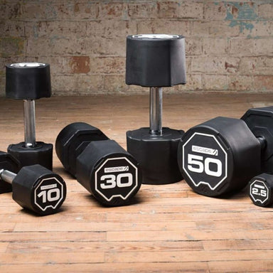Escape Fitness Nucleus Rubber SBX Dumbbells on a Wooden Gym Floor