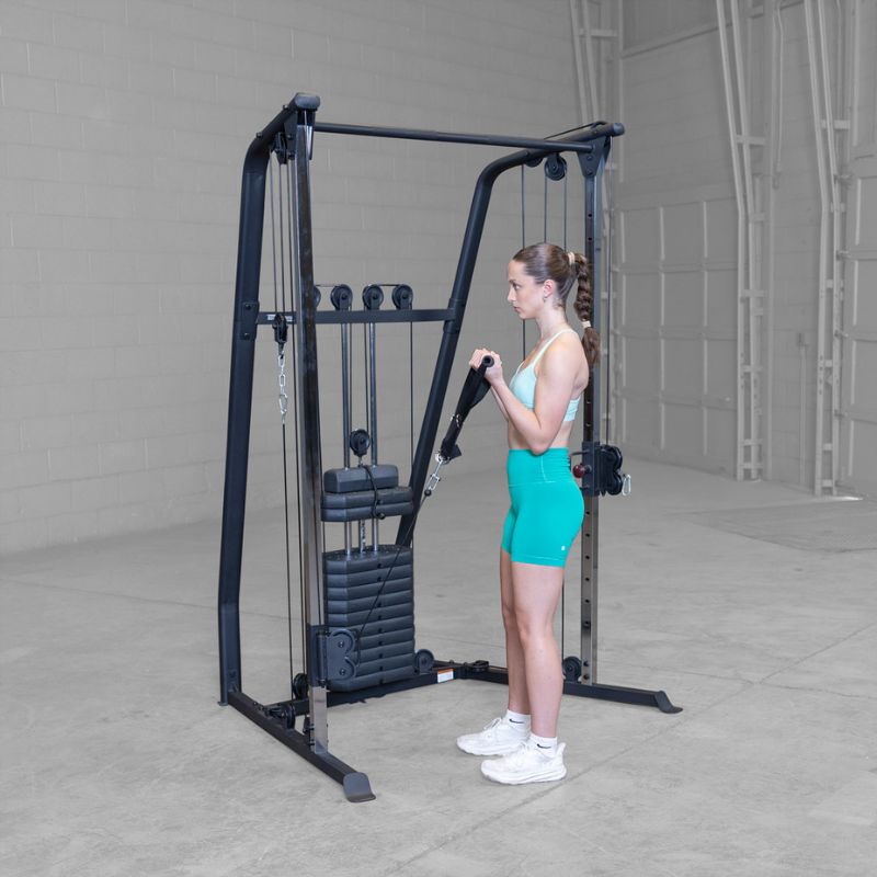 Female 2 Doing Knee Raise using Body-Solid Best Fitness BFFT10B Functional Trainer