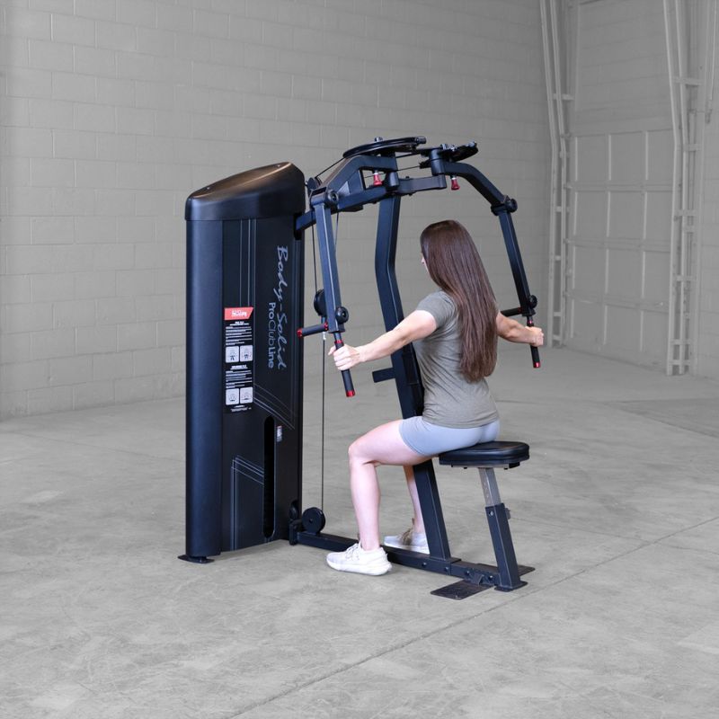 Female doing rear delt workout using Body-Solid Pro Clubline S2PECX Series 2 Pec Fly & Rear Delt