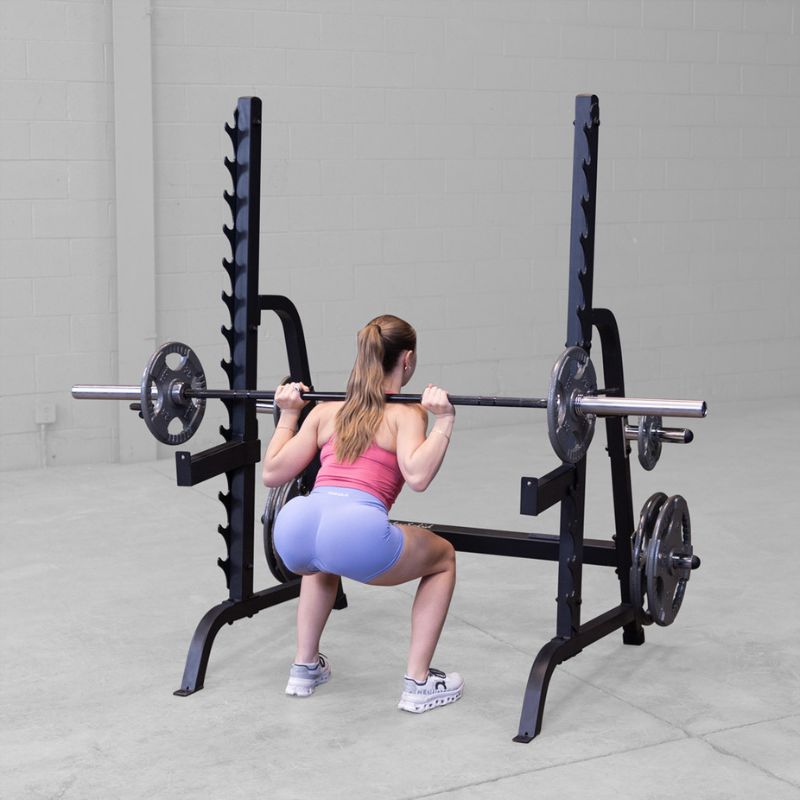 Female doing Barbell Squat using Body-Solid GPR370B Olympic Multi Press Rack (2)
