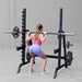 Female doing Barbell Squat using Body-Solid GPR370B Olympic Multi Press Rack