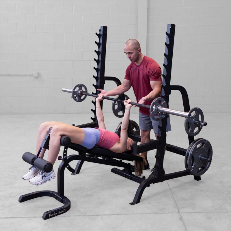 Female doing Decline Barbell Bench press using Body-Solid GPR370B Olympic Multi Press Rack