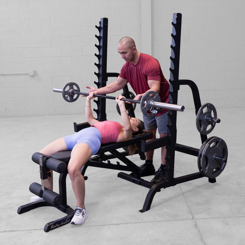 Female doing Flat Bench press using Body-Solid GPR370B Olympic Multi Press Rack
