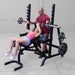 Female doing inclined barbell bench press using Body-Solid GPR370B Olympic Multi Press Rack