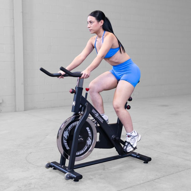 Female working out using Body Solid Best Fitness BFSB5B Indoor Training Cycle side view
