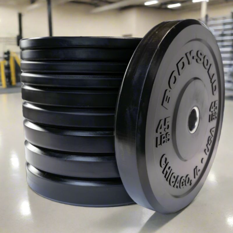 OBPX  Body Solid Black Chicago Extreme Bumper Plates Set inside Gym 