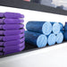 Power Systems Pilates Ring with Foam Rollers in a rack