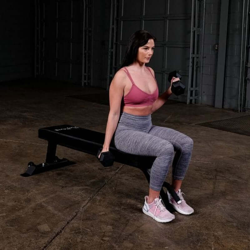 SFB125  Body Solid Pro Clubline Flat Utility Bench Sample Exercise with Dumbbell