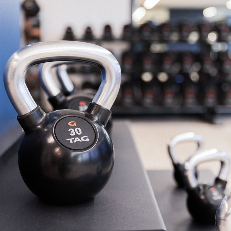 TAG Fitness Rubber Encased Kettlebell with Chemical Chrome Handle Set in Rack