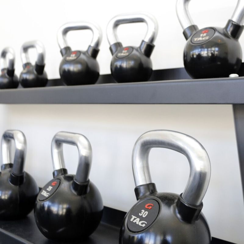 TAG Fitness Rubber Encased Kettlebell with Chemical Chrome Handle Set in Rack