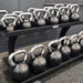 TAG Fitness Rubber Encased Kettlebell with Chemical Chrome Handle inside Gym with Rack