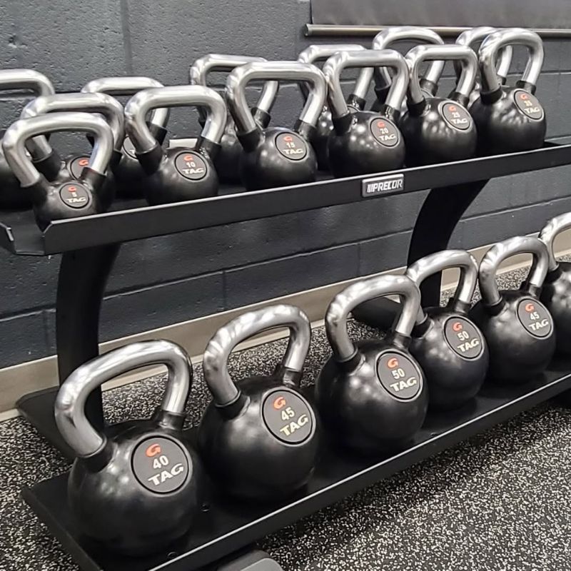 TAG Fitness Rubber Encased Kettlebell with Chemical Chrome Handle inside Gym with Rack