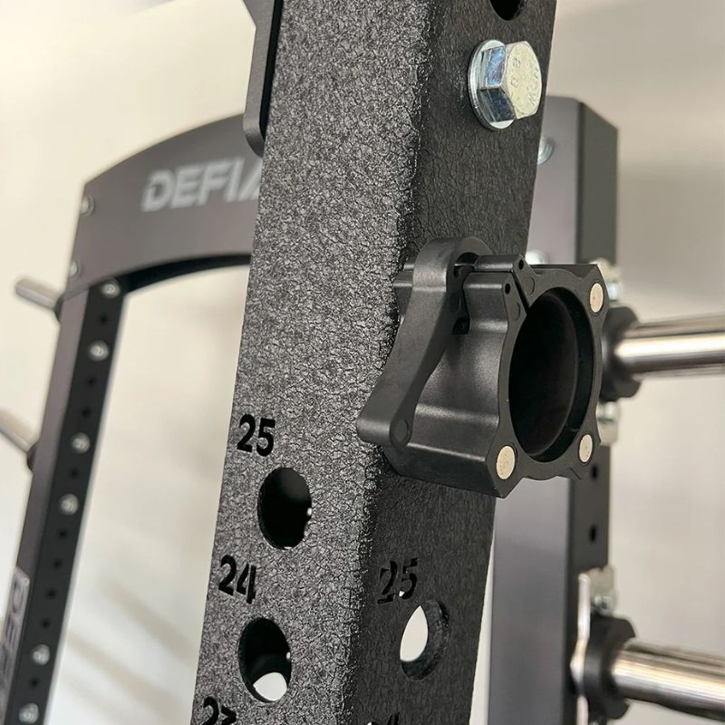 TKO Strength Quick Release Olympic Collar w_Magnets - 813OCM storedd in Plate Loaded Machine