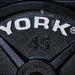 YORK Legacy_ Cast Iron Precision Milled Olympic Plate York Logo on 45 lb Weight Plate