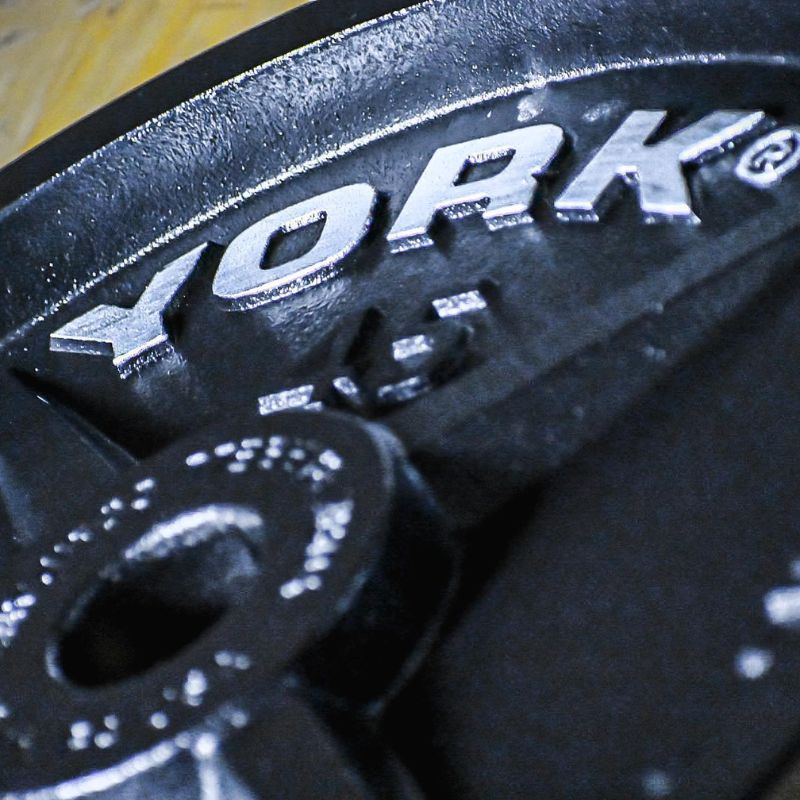 YORK Legacy_ Cast Iron Precision Milled Olympic Plate York Logo on 45 lb Weight Plate Side View