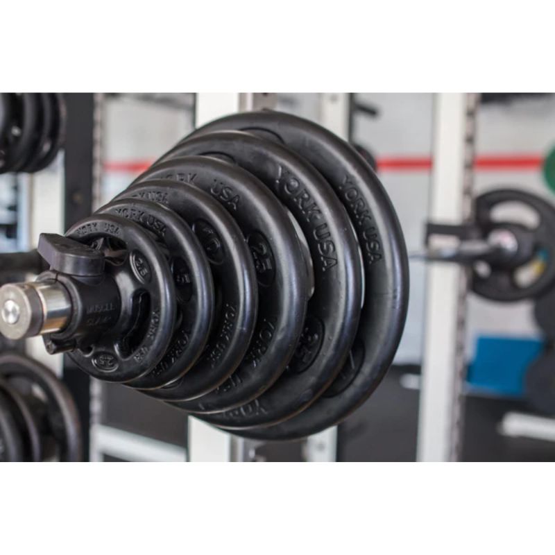 York 300lb Iso-Grip Rubber-Encased Steel Olympic Plate Set inside Gym