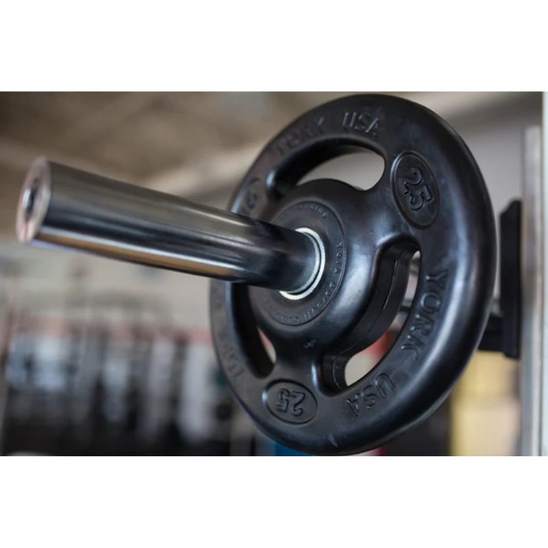 York 300lb Iso-Grip Rubber-Encased Steel Olympic Plate Set inside Gym attached to Rack