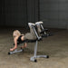 Body Solid Powerline Leg Curl Leg Extension Machine | PLCE165X - Sample Exercise with Plates